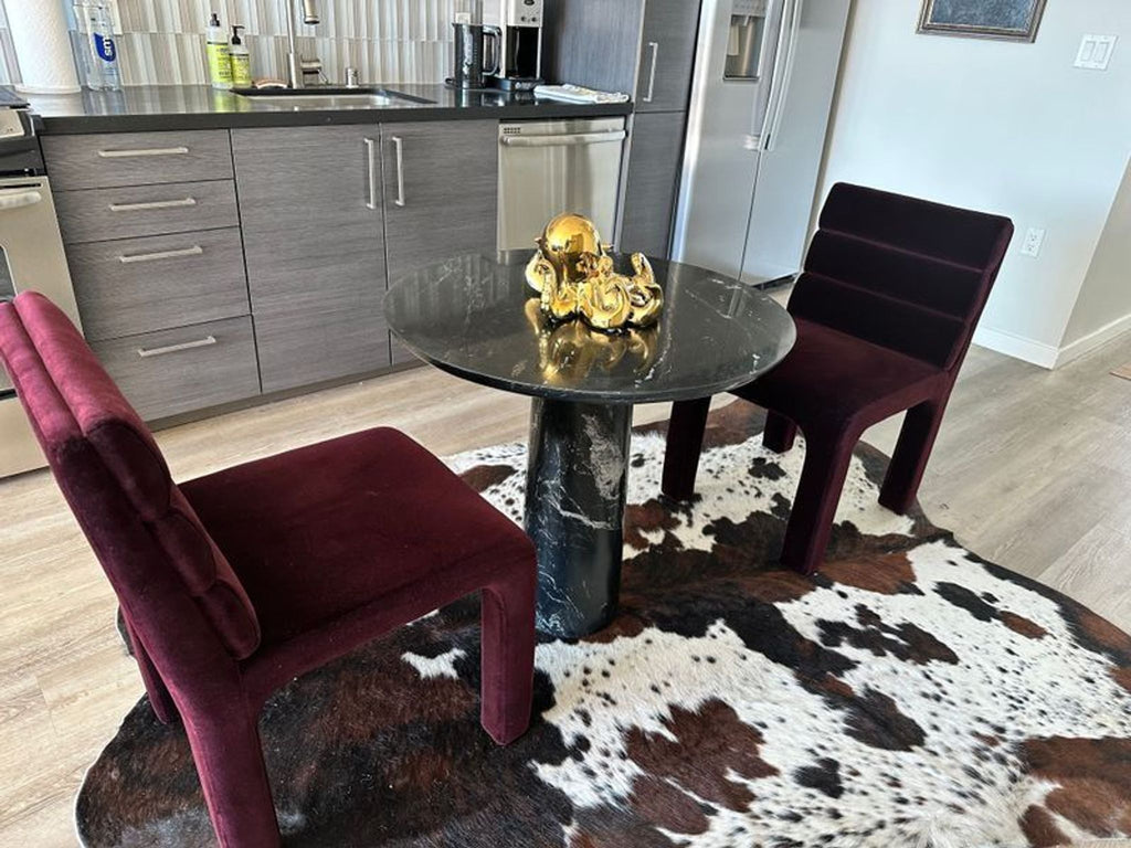 1. Modern Crate and Barrel dining chair with a sleek wooden frame and neutral upholstered seat and back.  