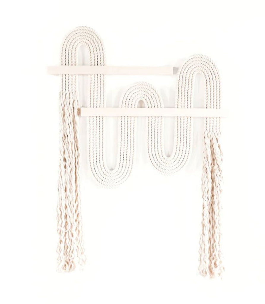 1. Neutral fiber wall art from West Elm Candice Luter, featuring wavy rope and hanging fringe, mounted on wood slats.