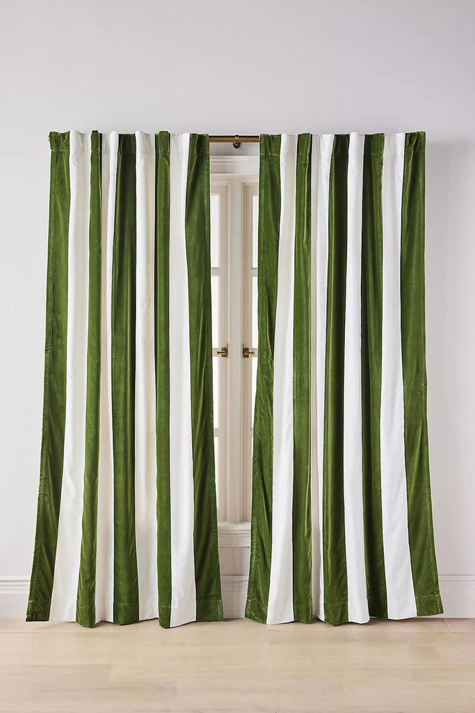 2. Close-up view of a plush velvet curtain with alternating dark green and white vertical stripes.