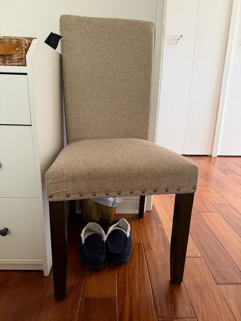 1. Set of four Pottery Barn dining chairs with a classic design, ideal for a modern dining room.  