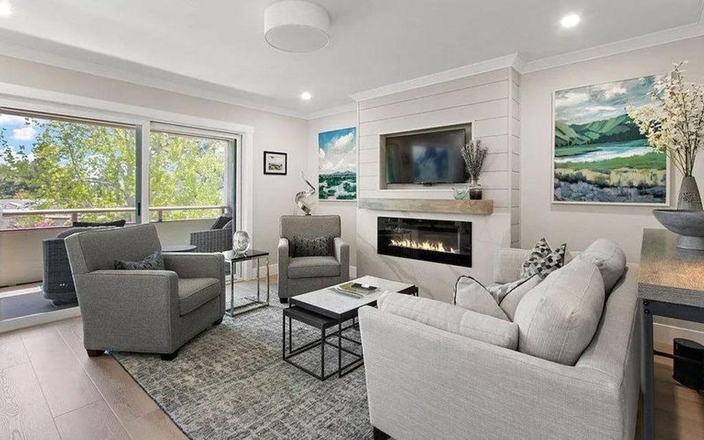Modern living room with stackable tables by Reperch near a cozy fireplace.