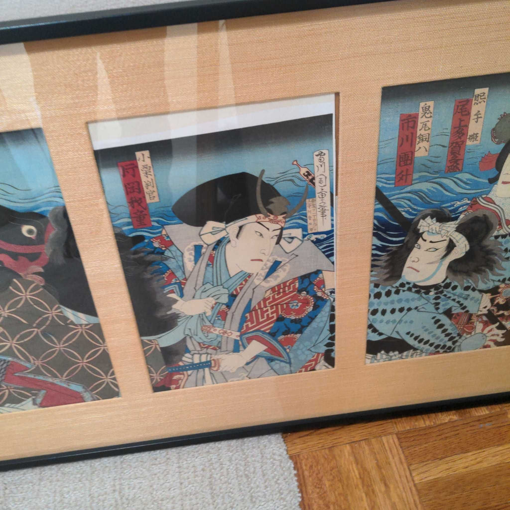 1. Close-up of a framed Japanese ukiyo-e triptych print featuring three samurai figures with rich colors and details.