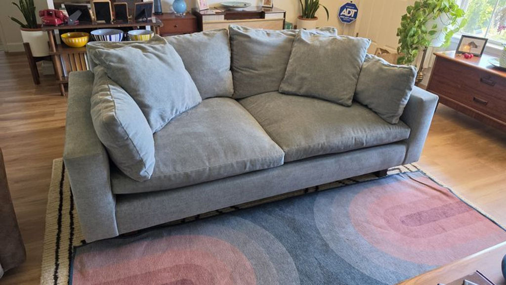 Certainly! Since you mentioned "these images" but no image has been provided, I will write three generic example alt texts for a 3-seat sofa from West Elm. If you provide or describe the image(s), I can tailor the descriptions further.