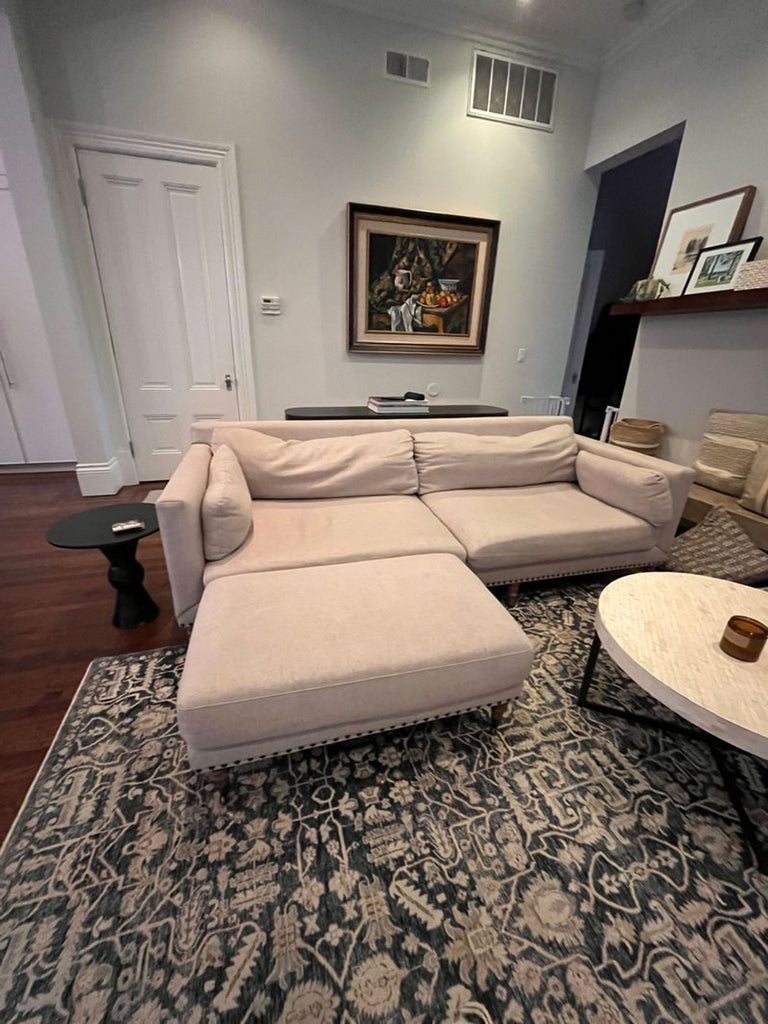 2. Stylish Pottery Barn 3-seat sofa featuring soft fabric and a spacious design for comfortable seating.