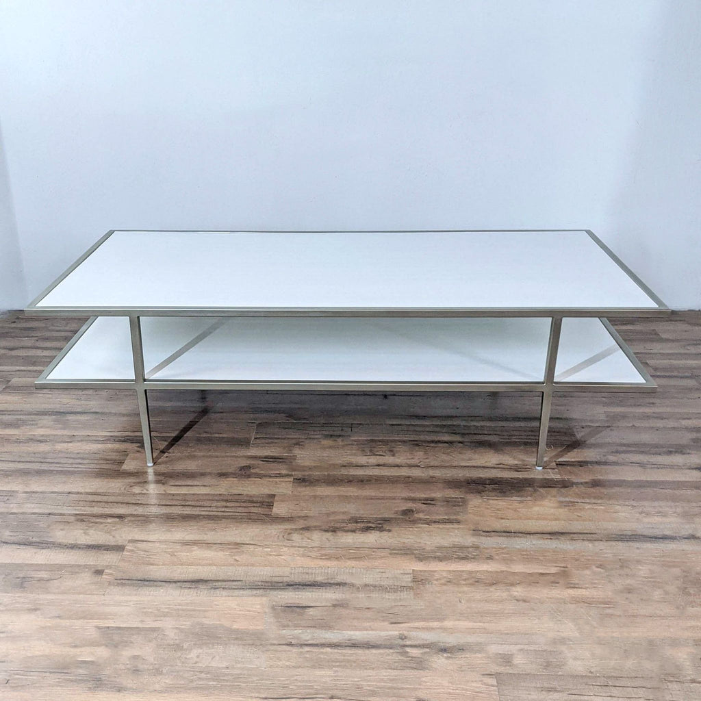 a chrome and glass coffee table with a white top.