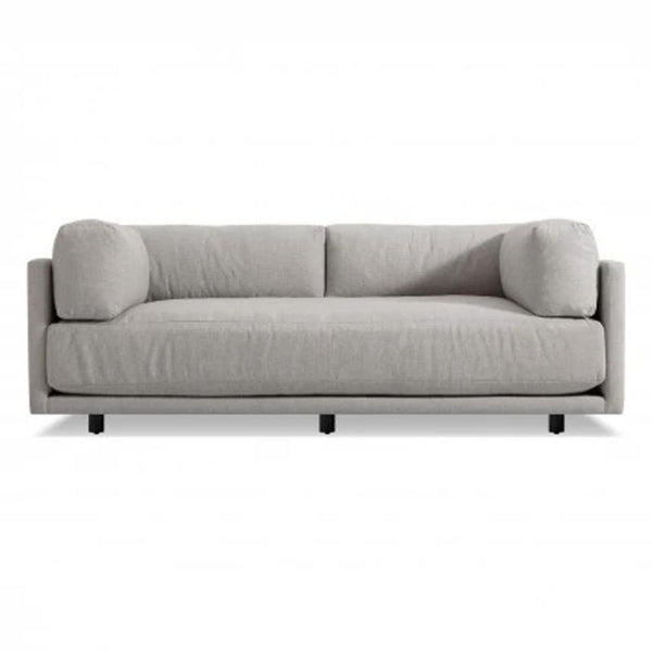 Modern light gray 3-seat sofa by Blue Dot with plush cushions and low black legs, viewed from the front.