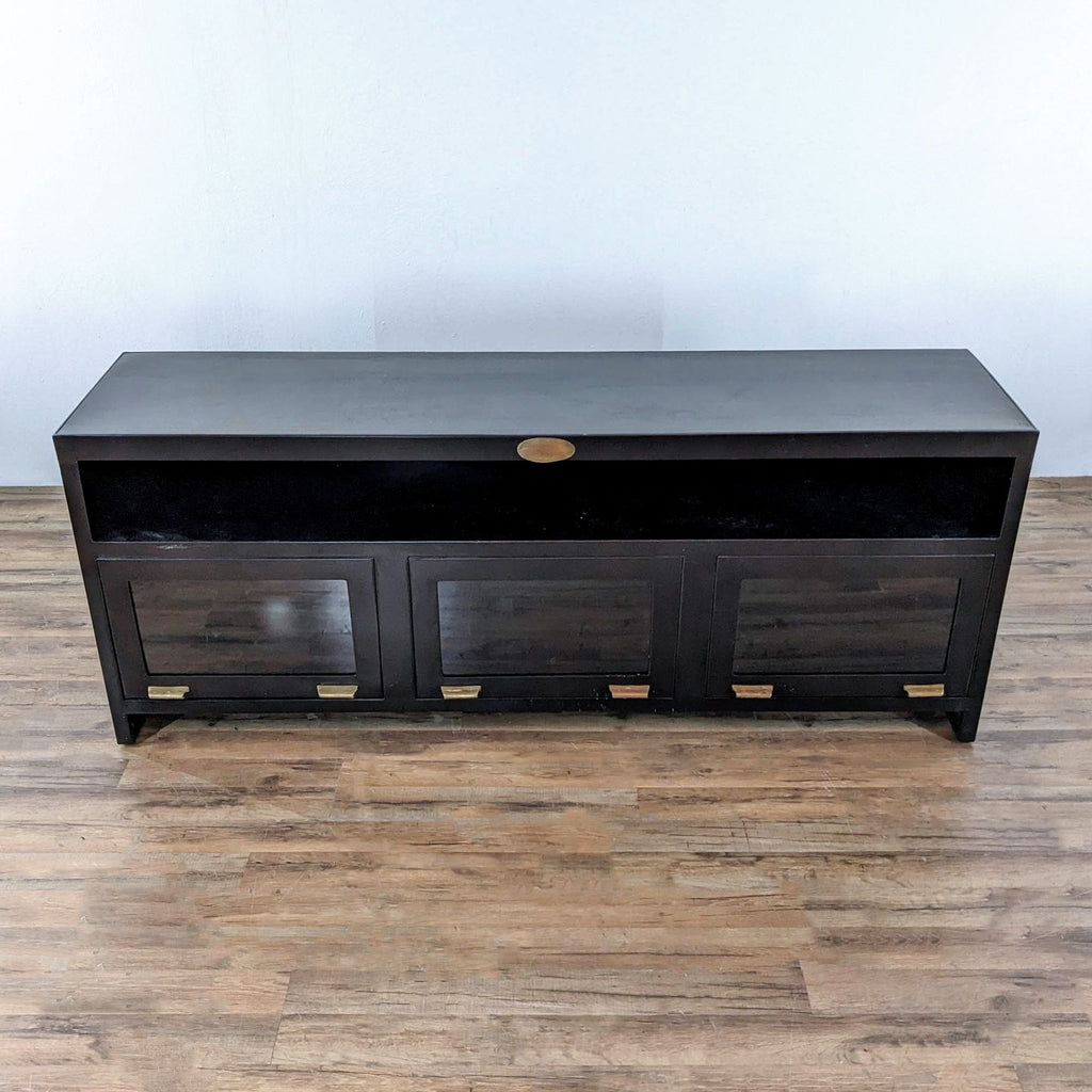 a vintage black lacquer buffet with brass pulls.