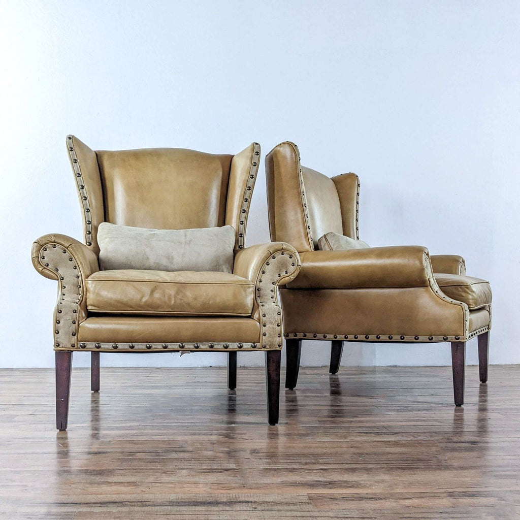 a pair of french leather wingback chairs