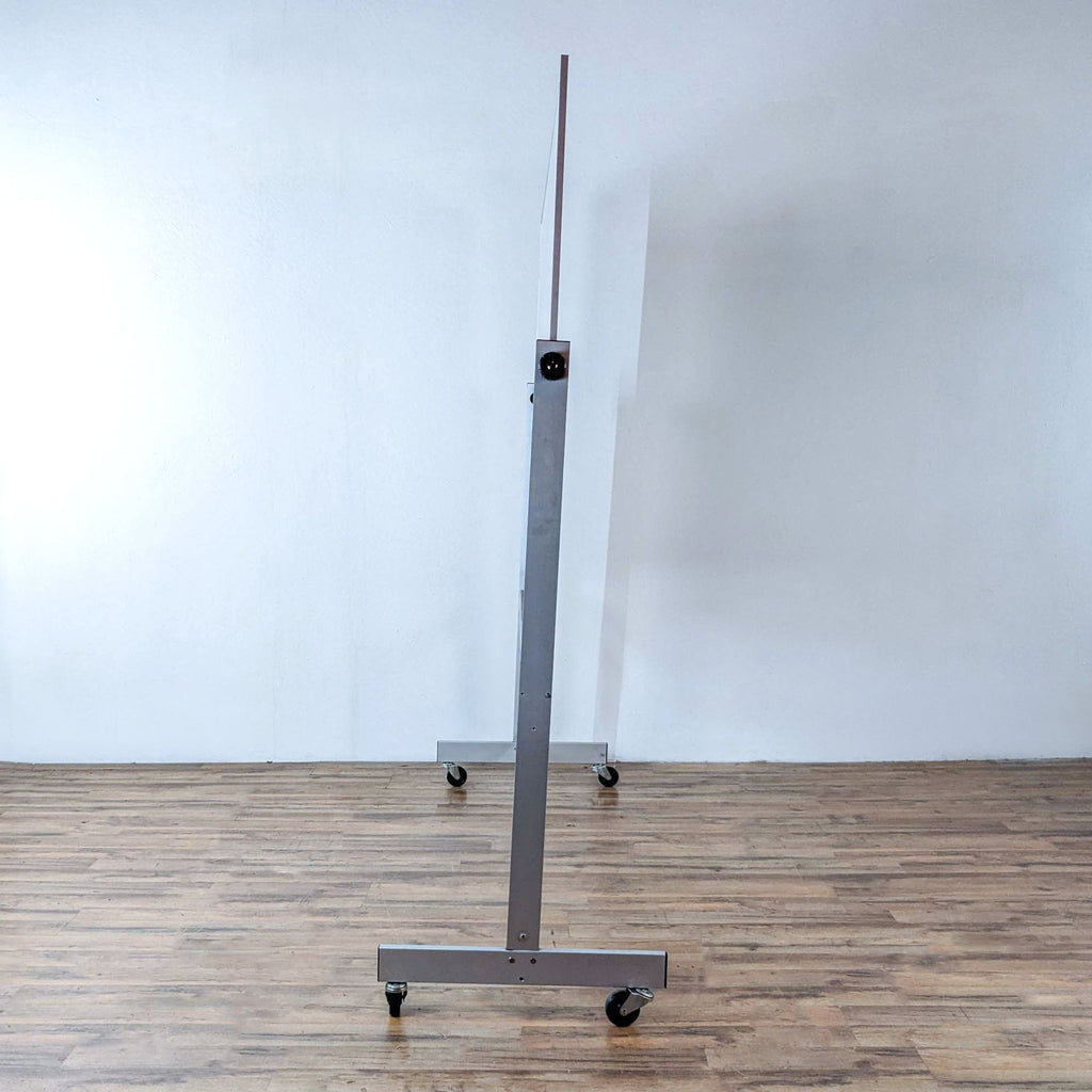 Slim side view of a rolling dry erase board, showing its structure.