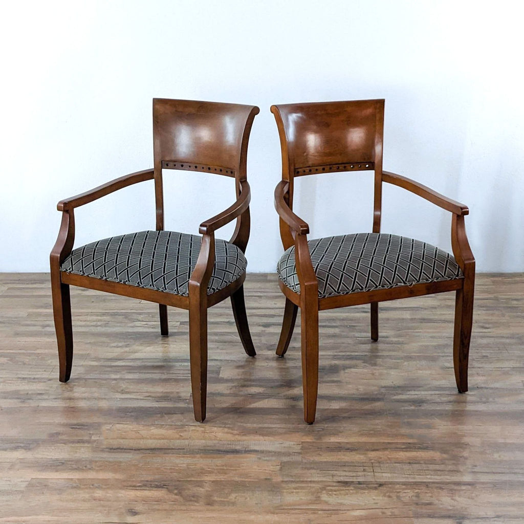 Pair of neoclassical chairs with wood frames and patterned upholstery.  