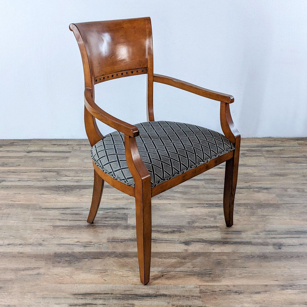 Single neoclassical chair with wood arms and patterned upholstered seat.  