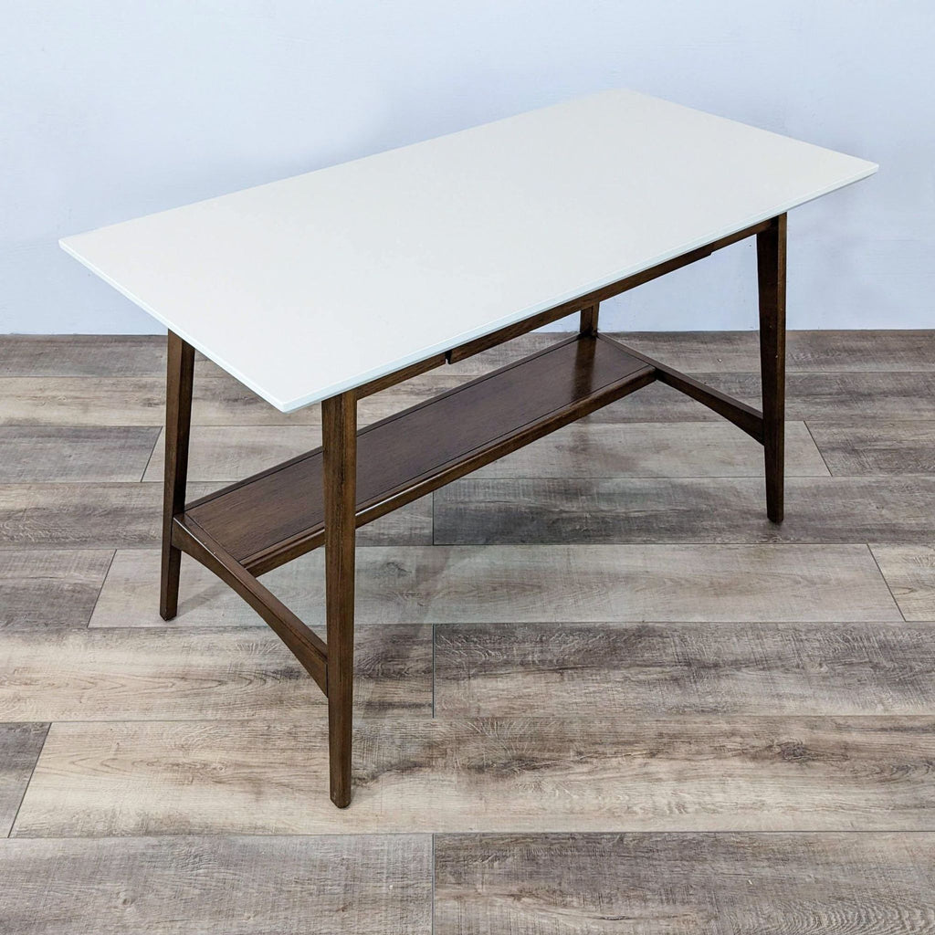 White-top desk featuring a wood frame and a single open drawer in a modern setting.