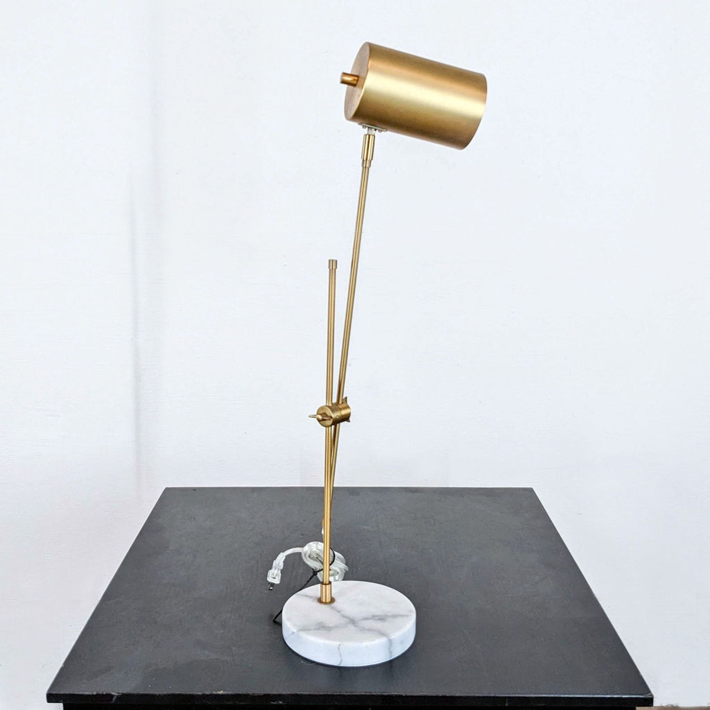 a brass table lamp by [ unused0 ].