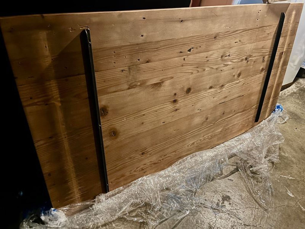 2. Underside of a Reperch wooden dining table showing construction details and sturdy support bars.  