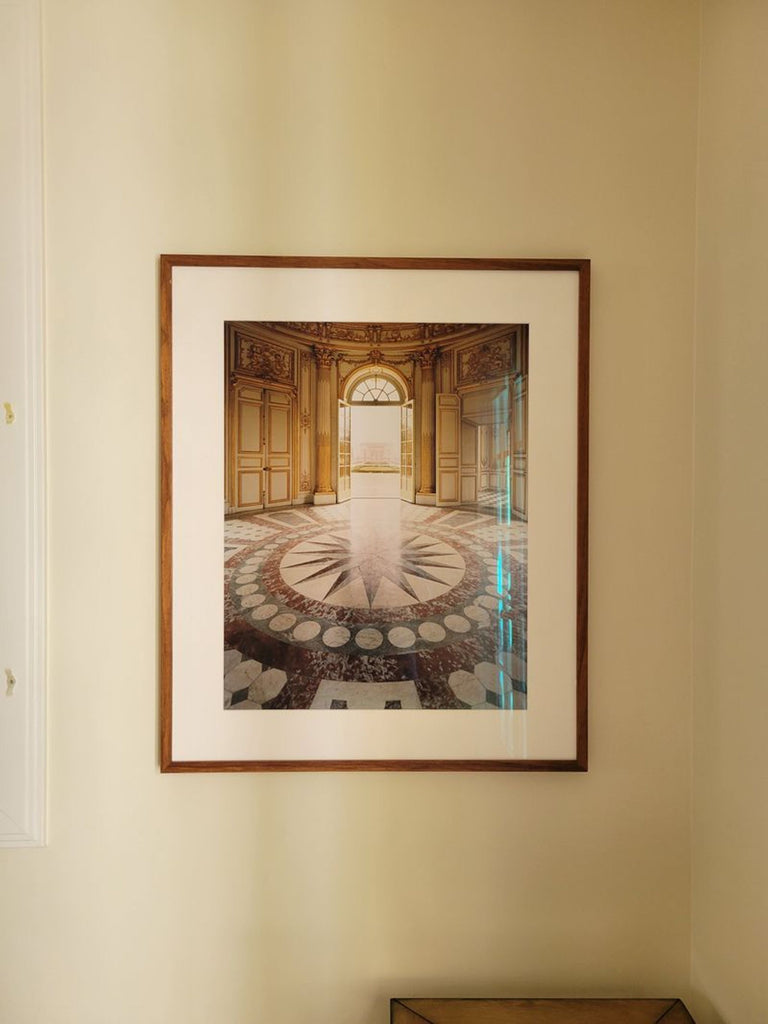 High-quality photograph print of a grand palace hallway, showcasing intricate details in a stylish, matted frame.