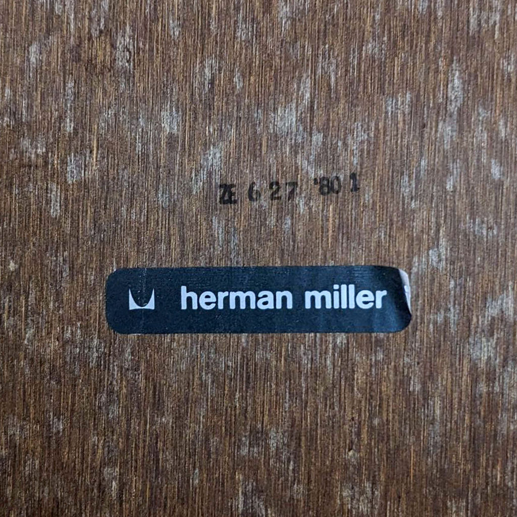 Herman Miller branding and authentication number on the underside of the table.