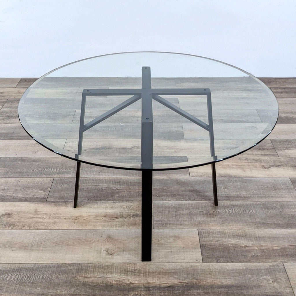 the table is made of glass and is made from a single piece of glass.