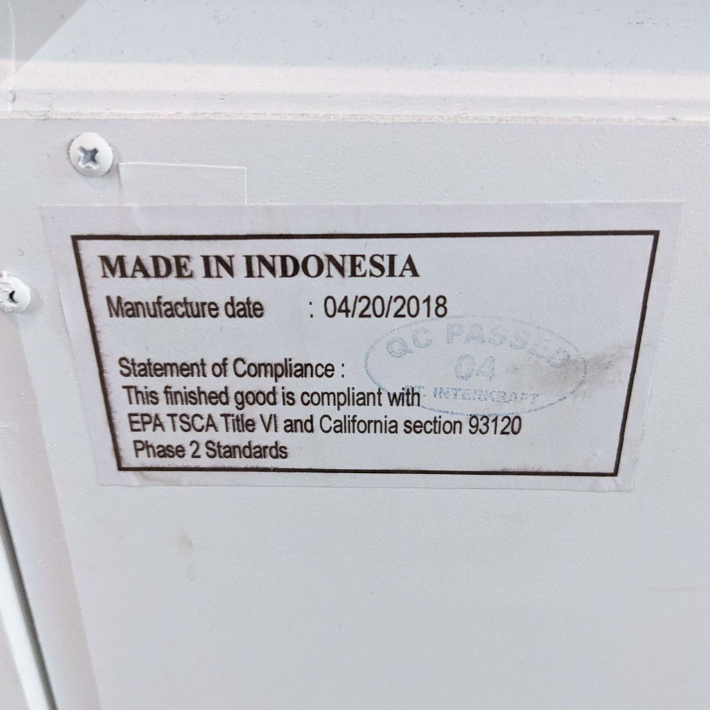 Compliance label on the Reperch end table with manufacture details.
