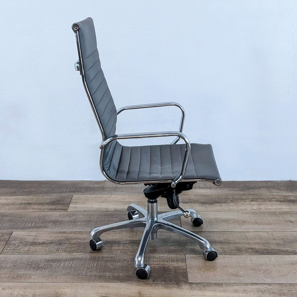 a vintage [ unused0 ] office chair with a chrome frame and a black leather upholster