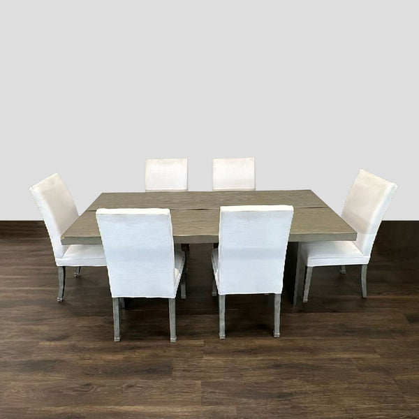 Restoration Hardware dining set with light wood table and six white upholstered chairs in modern style.