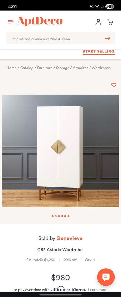 CB2 Astoria wardrobe in stylish wood veneer, featuring vertical door panels and chic metal accents.