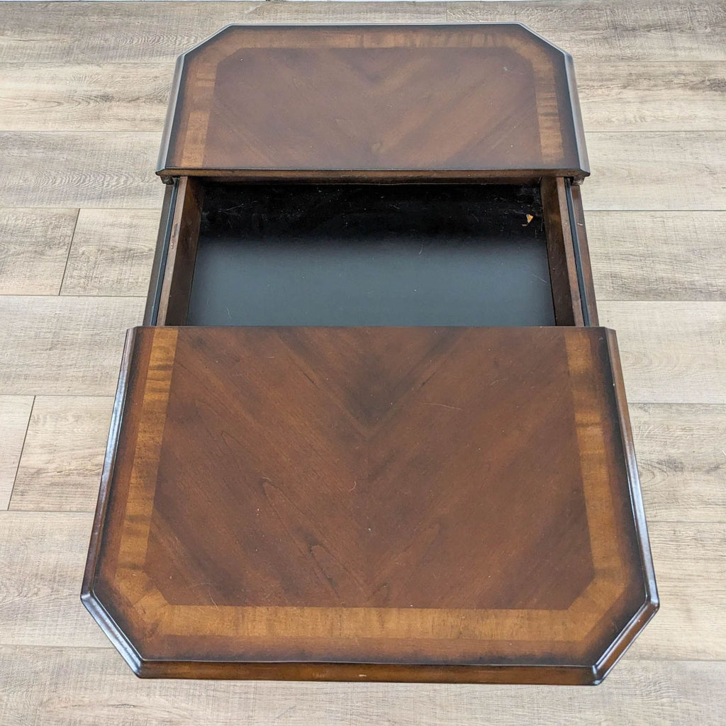 Open Reperch nightstand drawer showing inlaid wooden top detail.