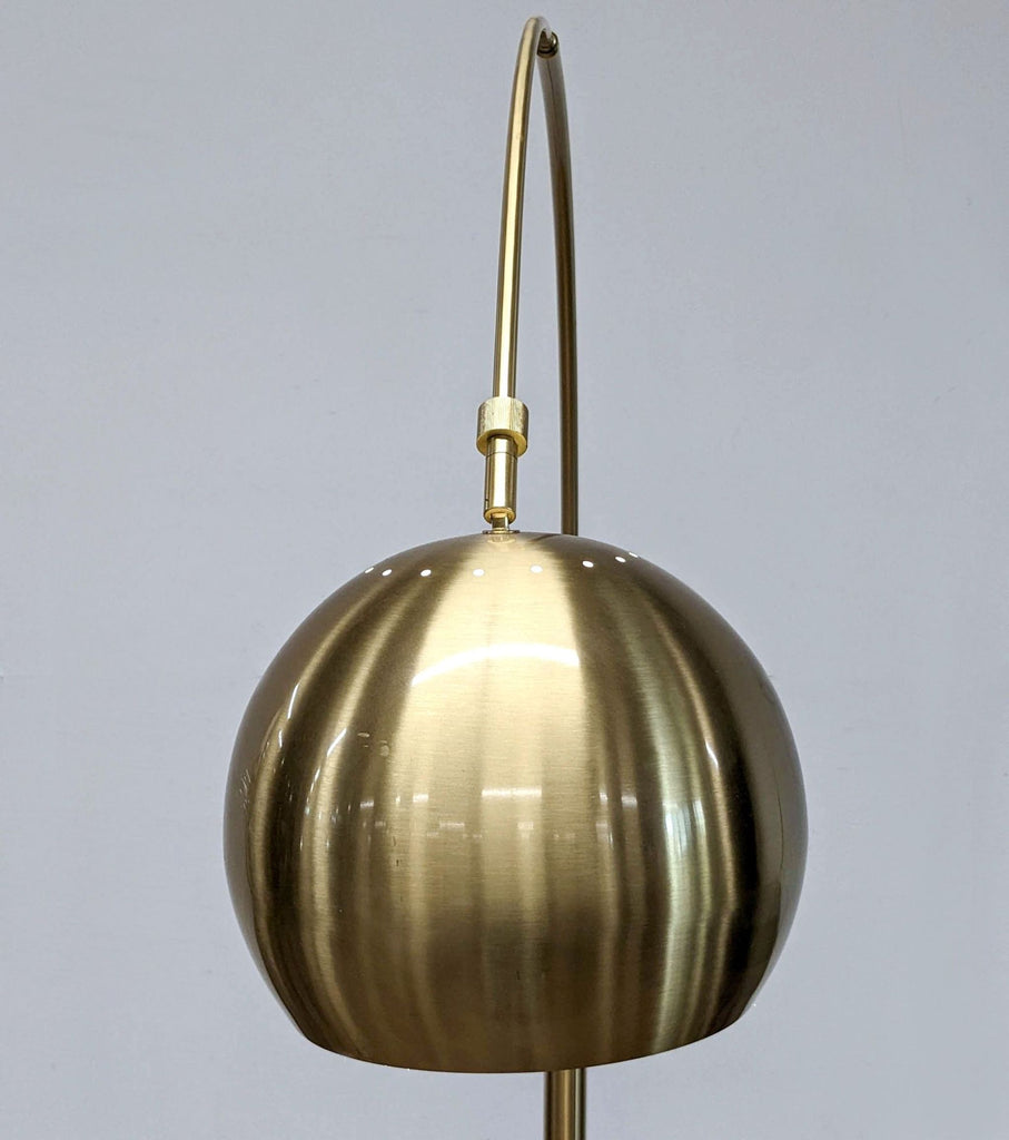 Close-up of Reperch lamp's golden dome-shaped shade.