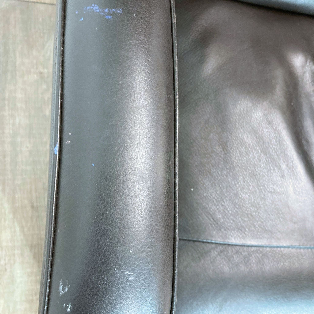 Close-up of the premium black leather texture on the Savoie 3.0 Zero Gravity recliner.