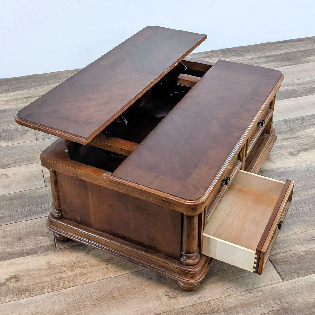 Wooden coffee table with lift-top and one drawer open.