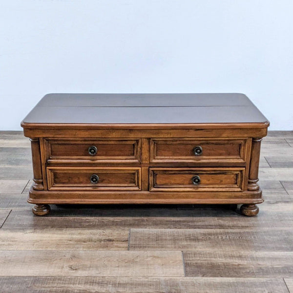 Bassett coffee table with closed top and two storage drawers.