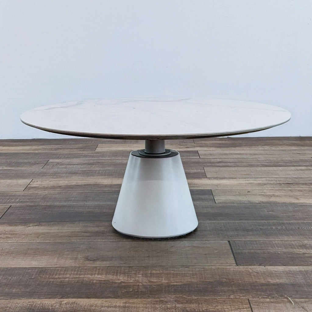 Side view of a modern coffee table with conical base.
