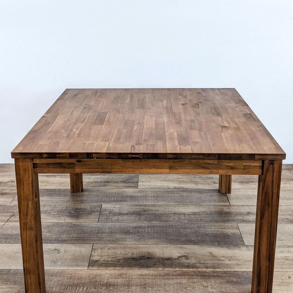 Amber-stained dining table with a butcher block design by Reperch.