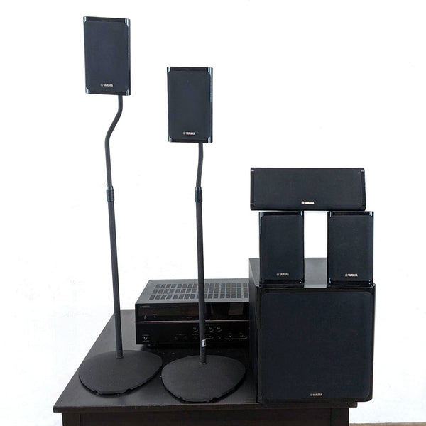 a set of speakers on a stand.