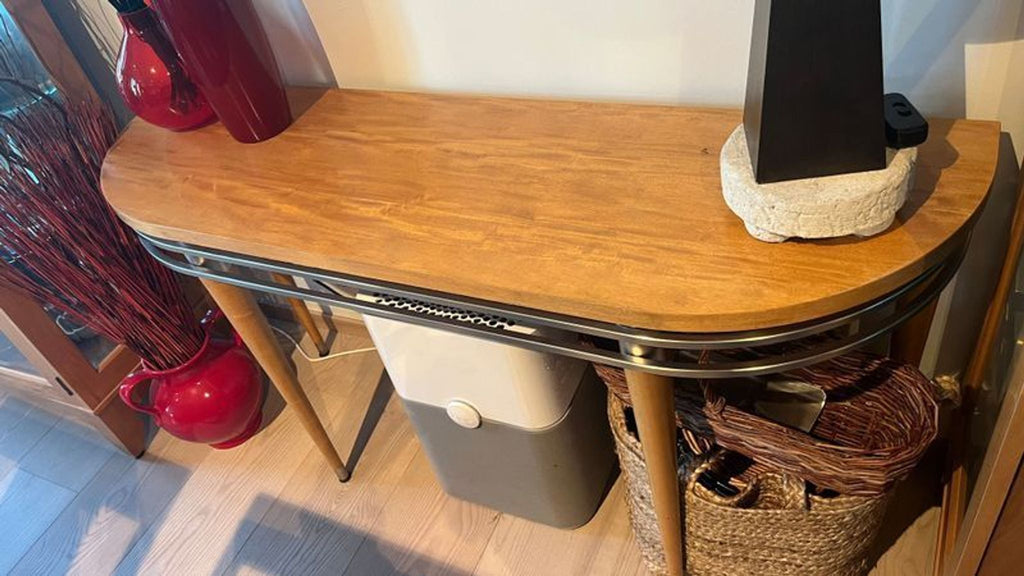 1. Ethan Allen side & console table with light wood top, metal trim, and tapered legs, styled in a living room.