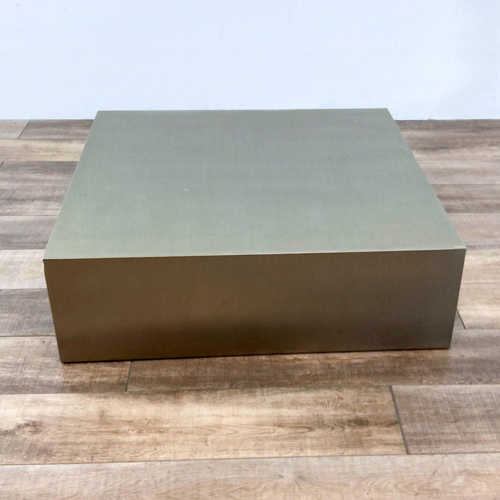 1. Mobital brushed stainless steel coffee table with a modern square design, shown on a wooden floor.