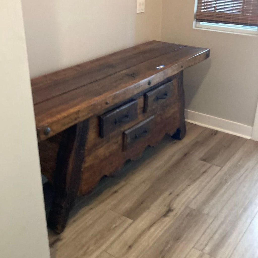 2. Vintage side table made of solid wood, featuring three drawers and distressed finish, set on wood flooring.