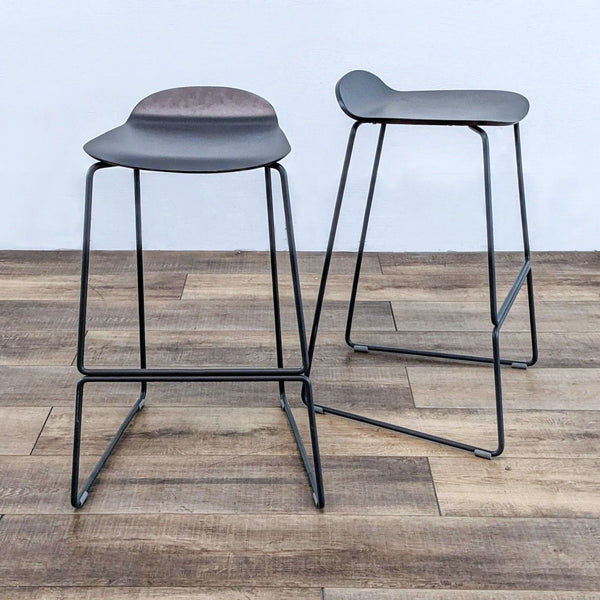 the stools are made from a solid wood and steel.