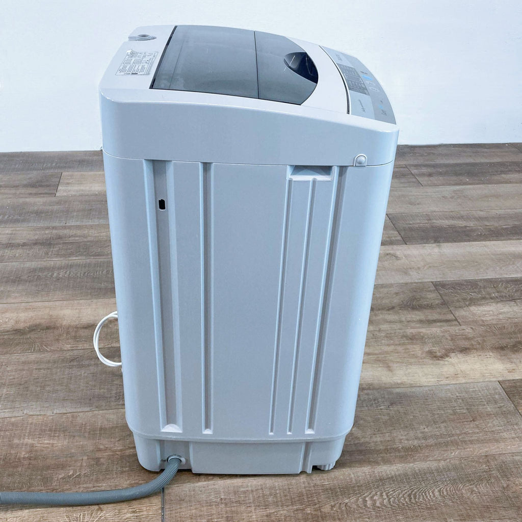 a white air purifier on a wooden floor.
