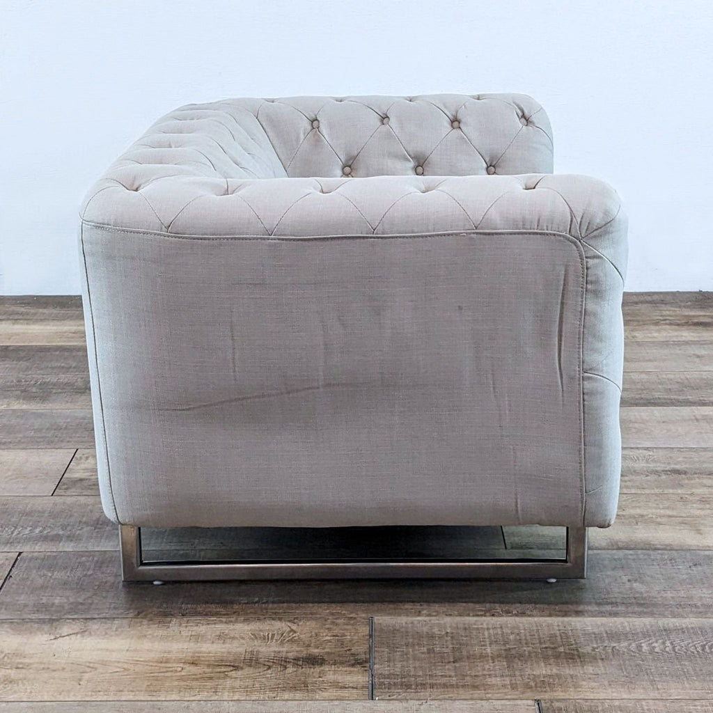 Lounge chair in soft fabric, featuring diamond button tufting and metal legs. Brand: Diamond Sofa.