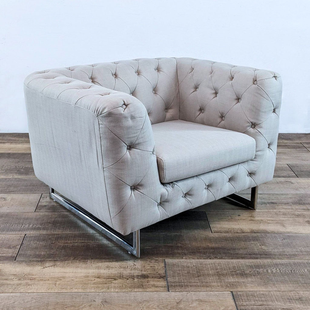 Elegant lounge chair with tufted upholstery and stainless steel legs, from Diamond Sofa's collection.