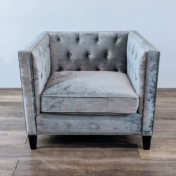 Reperch lounge armchair with tufted fabric and wooden feet.