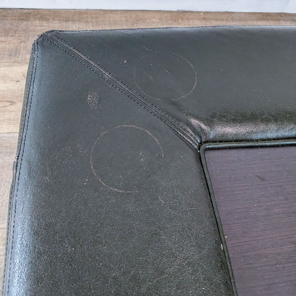 Side view of Reperch black coffee table, highlighting its square shape and low profile.