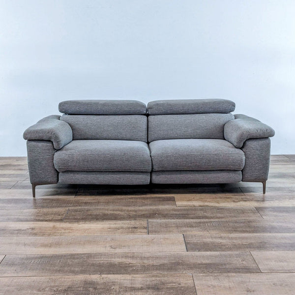 1. Living Space grey 85" dual reclining sofa with adjustable headrests, USB ports, and pillow top arms.