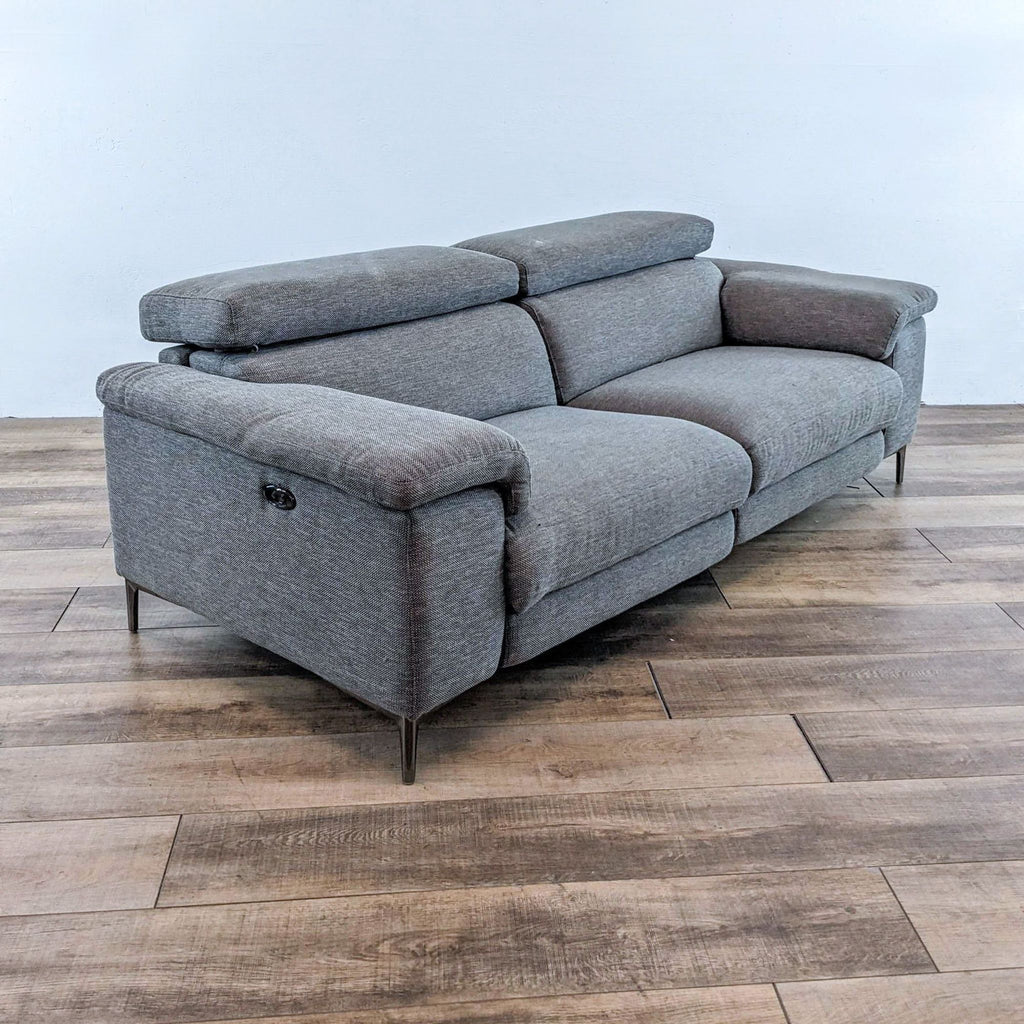 3. Modern 85" Living Space grey sofa with pillow top arms and USB ports, angled side view.