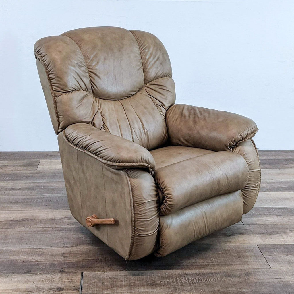 Side view of plush beige La-Z-Boy recliner with wooden lever for reclining.