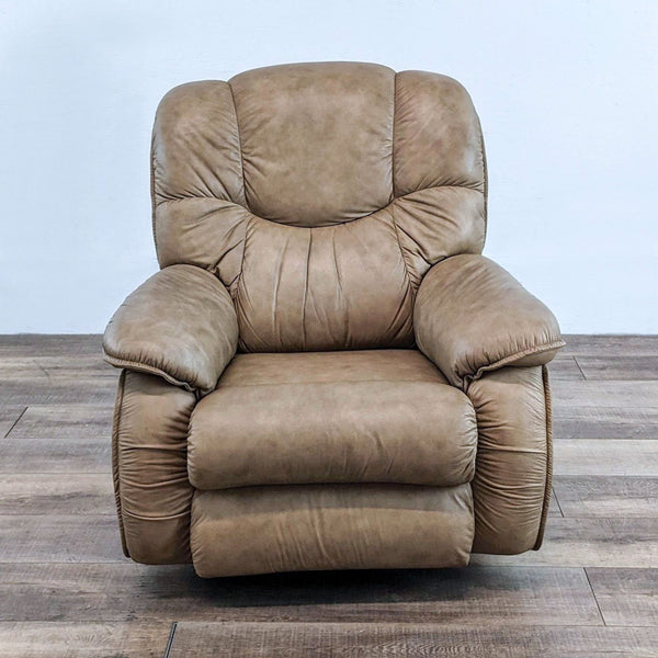 La-Z-Boy leather recliner, beige, with plush cushions, in a living room setting.