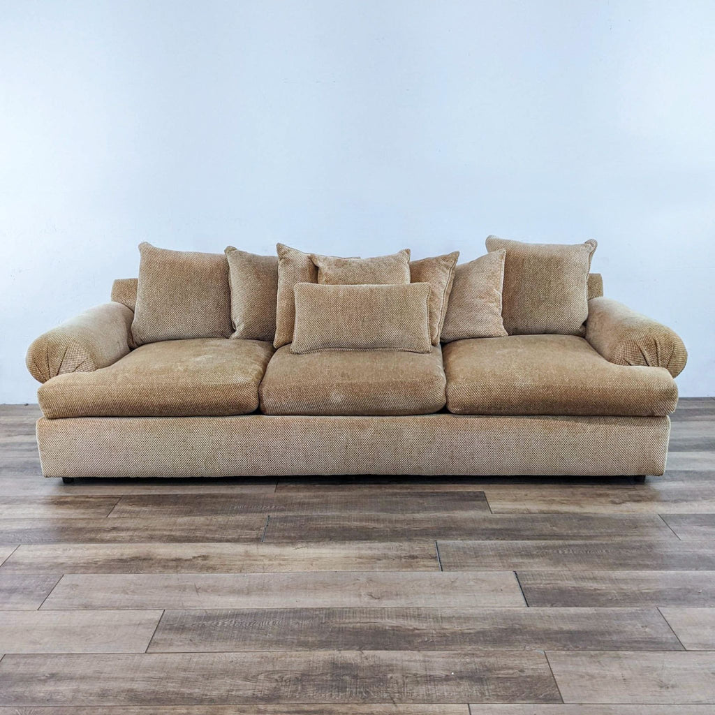 Large 112" sofa with rolled arms, small pattern fabric, three seats.