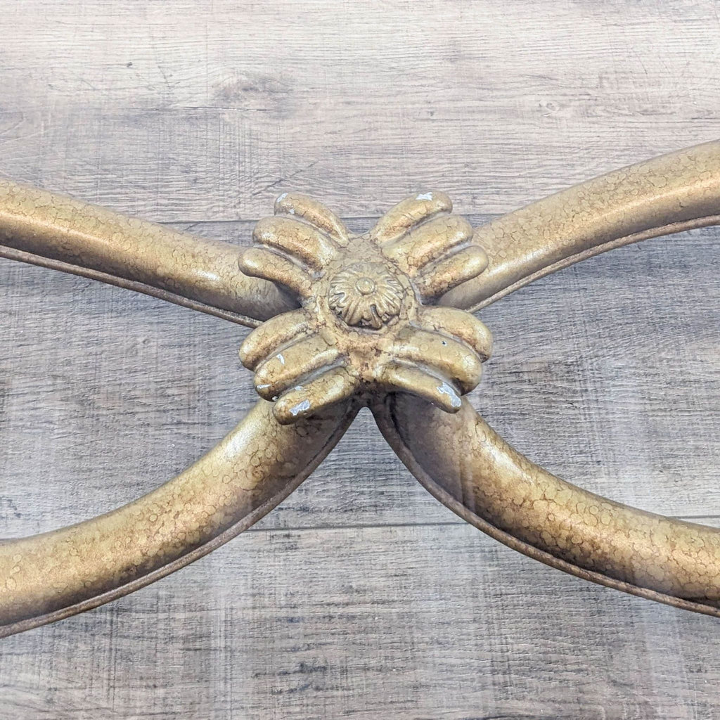 Close-up of the coffee table's intricate metal embellishment.  