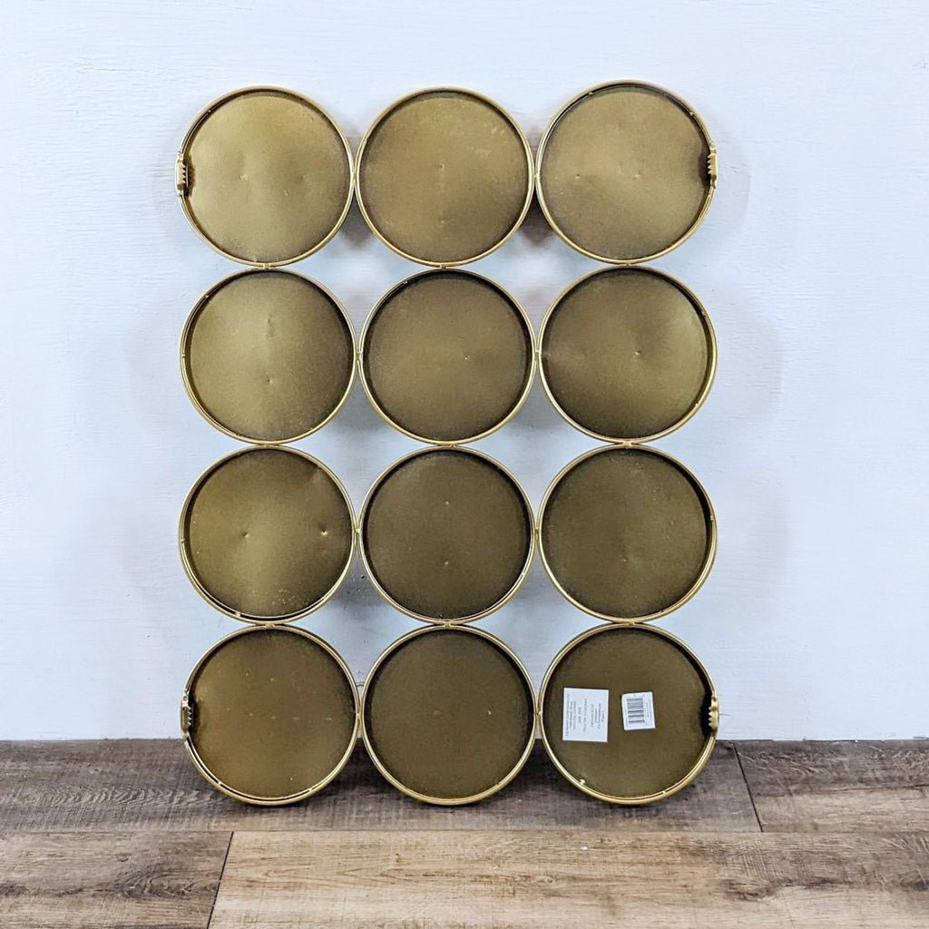 3. Backside of Zuo Modern Cycle Mirror shows twelve round gold-framed sections with solid backs and a product label.