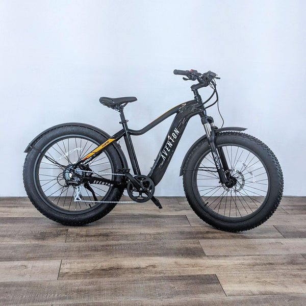 Aventon Aventure electric bike with a sleek black frame and robust tires.